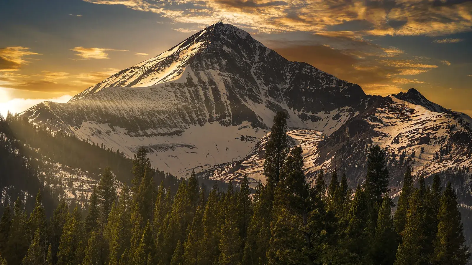 Mountain with some snow at sunset