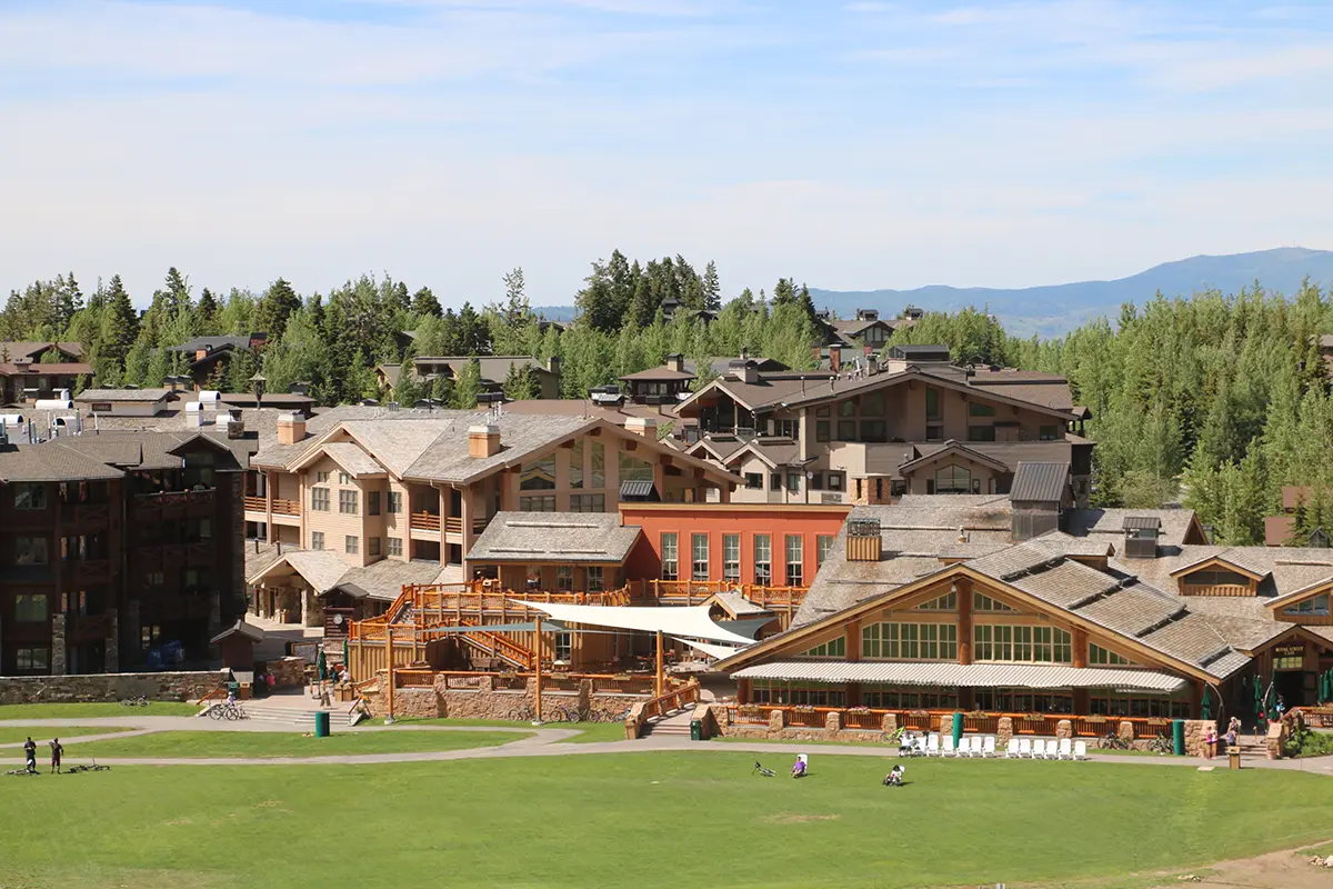 Deer Valley buildings seen from a grassy hill
